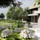 Villatuin in Oisterwijk met bloeiende hortensia's, gazon en loungeterras bij de woning